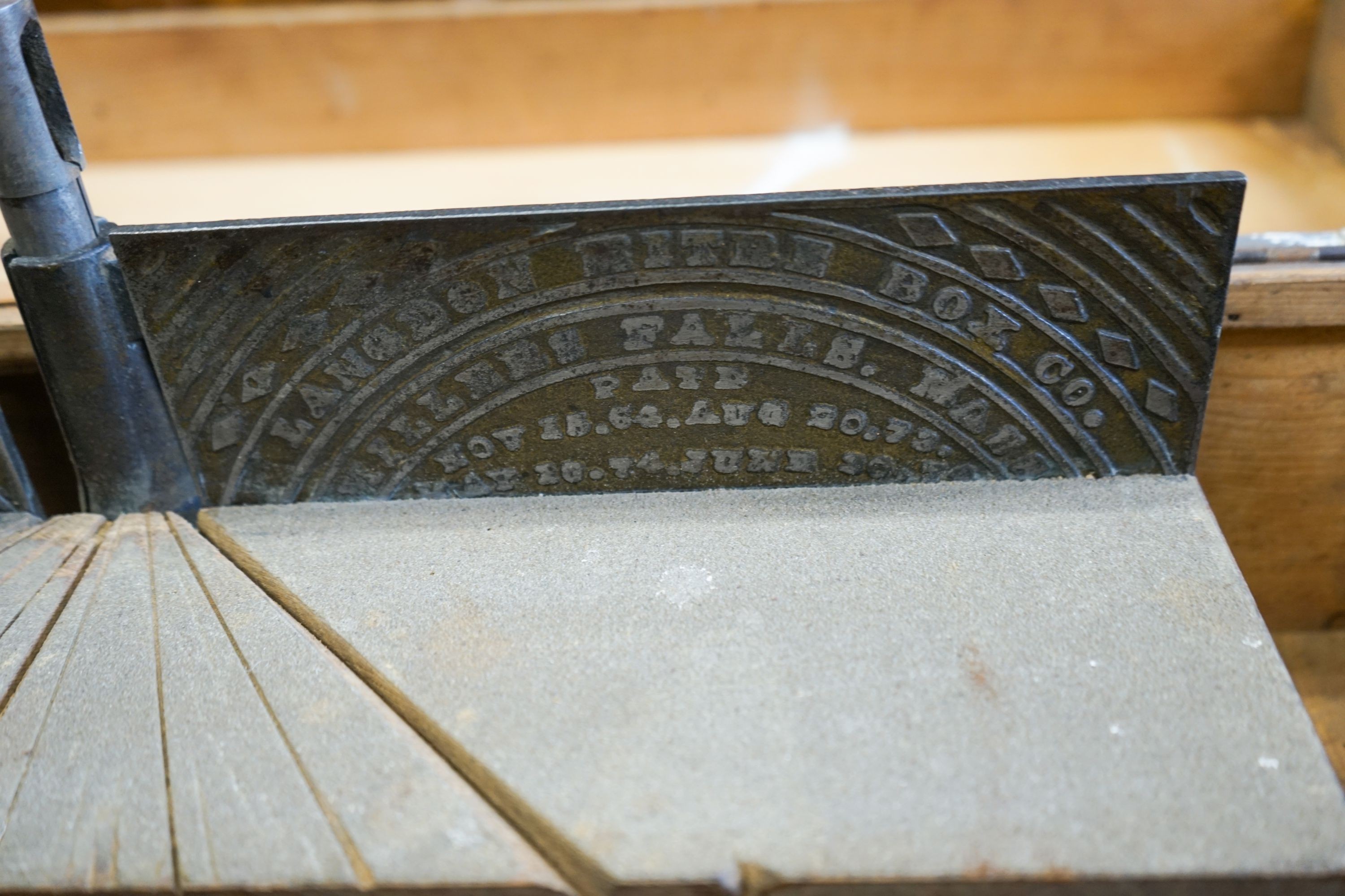 An early 20th century pine cased mitre saw, marked London Mitre Box Company